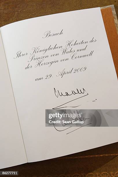 The presidential guest book shows the signatures of Charles, Prince of Wales, and Camilla, Duchess of Cornwall, at Bellevue Palace on April 29, 2009...