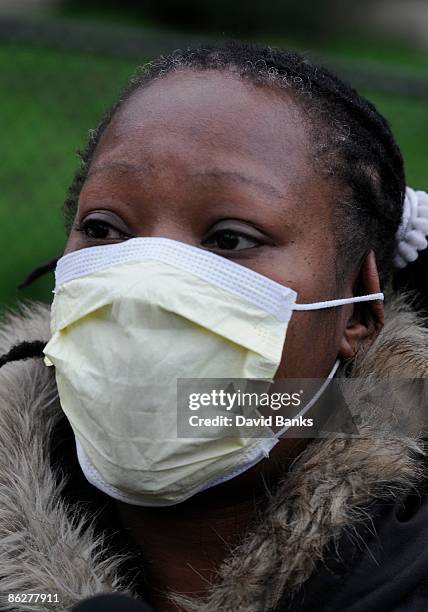 Arlette Crawford walks past Kilmer Elementary School April 29, 2009 in Chicago, Illinois. There has been a confirmed case of Swine Flu at the school...