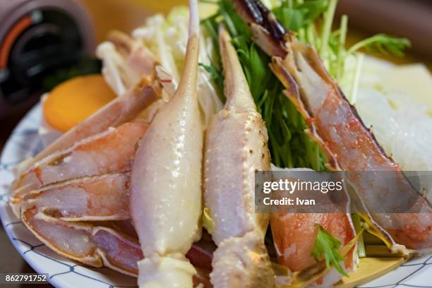 traditional japanese cuisine, fresh raw crab shabu shabu - crab pot stockfoto's en -beelden