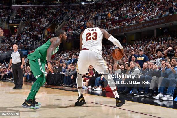 LeBron James of the Cleveland Cavaliers handles the ball against Kyrie Irving of the Boston Celtics on October 17, 2017 at Quicken Loans Arena in...