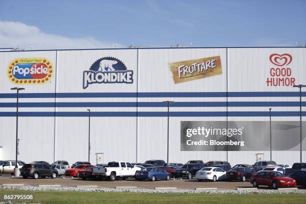 Vehicles sit parked outside of the Unilever Plc ice cream plant facility in Covington, Tennessee, U.S., on Tuesday, Oct. 3, 2017. Unilever is...