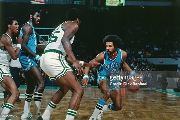 Randy Smith of the Buffalo Braves makes a move against Paul Silas of the Boston Celtics during a game played in 1976 at the Boston Garden in Boston,...