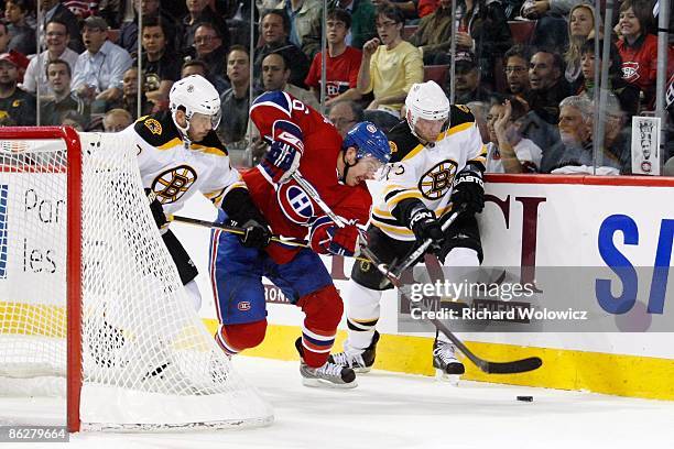 Josh Gorges of the Montreal Canadiens defends against Mark Recchi and Michael Ryder of the Boston Bruins during Game Four of the Eastern Conference...