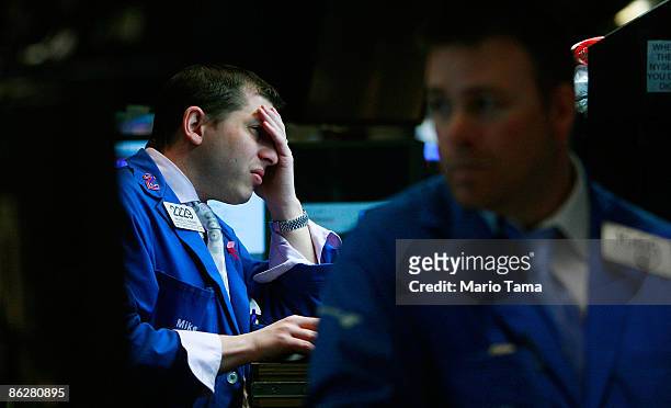Traders work on the floor of the New York Stock Exchange moments before the Federal Reserve announcement on interest rates April 29, 2009 in New York...
