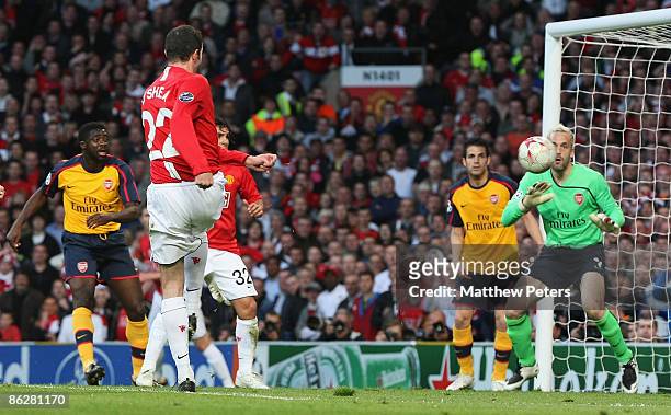 John O'Shea of Manchester United scores their first goal during the UEFA Champions League Semi-Final first leg match between Manchester United and...