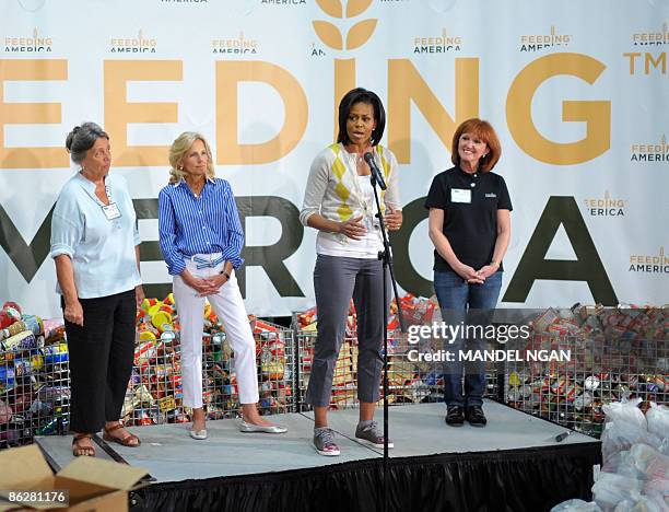 First Lady Michelle Obama speaks as Jill Biden the wife of Vice President Joe Biden, Lynn Brantley Executive Director Capitol Area Food Bank and...