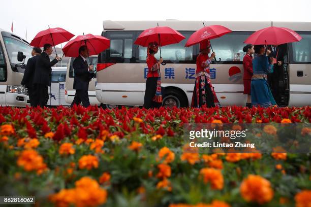 Delegates leave after the opening session of the 19th Communist Party Congress held at the Great Hall of the People on October 18, 2017 in Beijing,...
