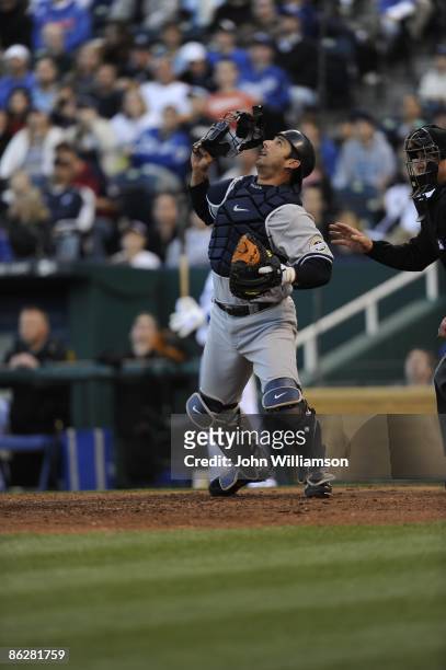 Catcher Jorge Posada of the New York Yankees fields his position as he reacts to an infield pop fly in front of home plate during the game against...