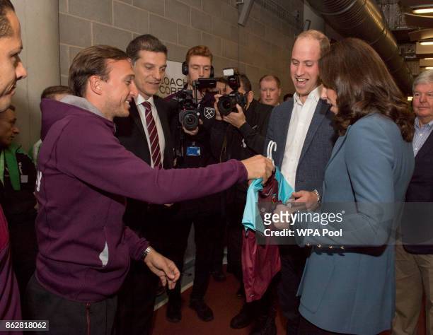 Prince William, Duke of Cambridge and Catherine, Duchess of Cambridge chat with West Ham player, Mark Noble and West Ham manager Slaven Bilic during...