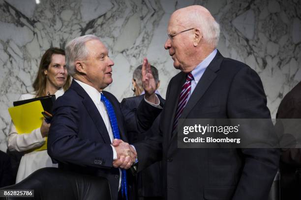 Jeff Sessions, U.S. Attorney general, shakes hands with Senator Patrick Leahy, a Democrat from Vermont, right, while arriving to testify during a...