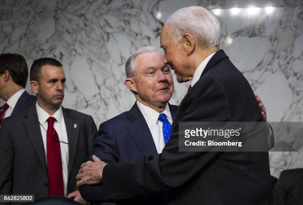 Jeff Sessions, U.S. Attorney general, speaks with Senator Orrin Hatch, a Republican from Utah, right, while arriving to testify during a Senate...