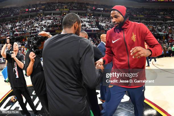 Kyrie Irving of the Boston Celtics shakes hands with Tristan Thompson of the Cleveland Cavaliers before the game on October 17, 2017 at Quicken Loans...