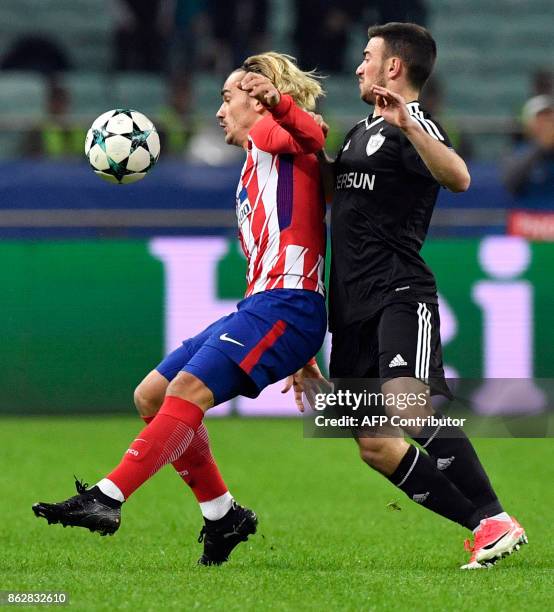 Atletico Madrid's forward from France Antoine Griezmann and Qarabag's defender from Azerbaijan Gara Garayev vie for the ball during the UEFA...