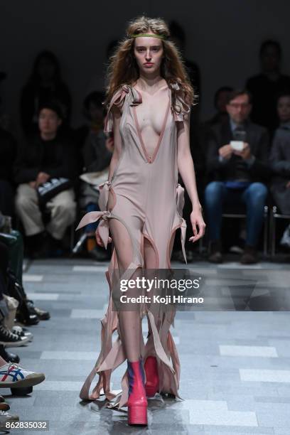 Model walks on the runway during the KEISUKEYOSHIDA show as part of Amazon Fashion Week Tokyo 2018 S/S at Shibuya Hikarie Hall on October 17, 2017 in...