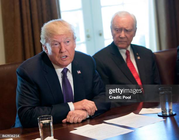 President Donald Trump, with Sen. Orrin Hatch Chairman of the Senate Finance Committee, speaks during a meeting with members of the Senate Finance...