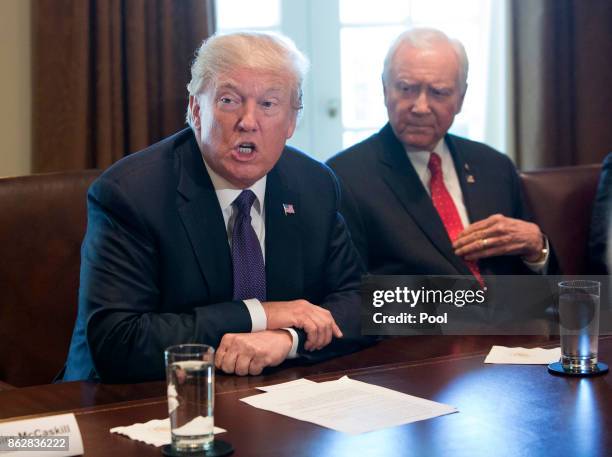 President Donald Trump, with Sen. Orrin Hatch Chairman of the Senate Finance Committee, speaks during a meeting with members of the Senate Finance...