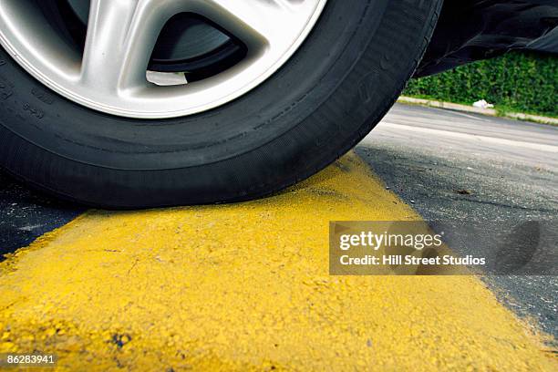 car and speed bump - speed bump stock pictures, royalty-free photos & images