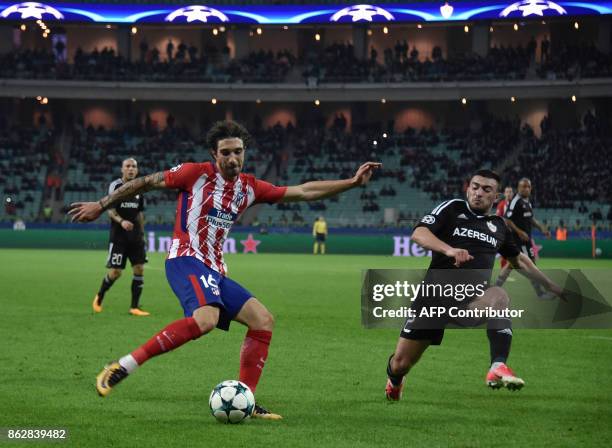 Atletico Madrid's defender from Croatia Sime Vrsaljko and Qarabag's defender from Azerbaijan Gara Garayev vie for the ball during the UEFA Champions...