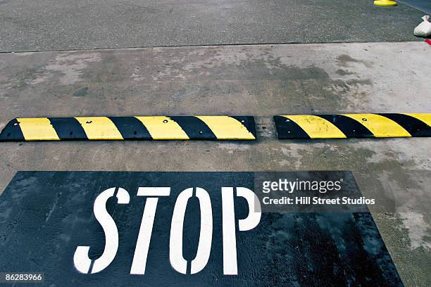 speed bump with "stop - speed bump stock pictures, royalty-free photos & images