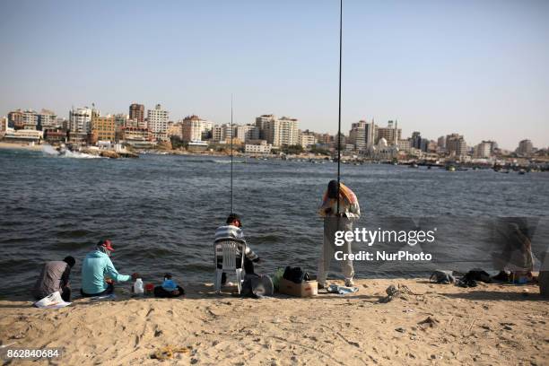 Palestinian fishermen fishes at the port in Gaza city in Gaza City on October 18, 2017 on the first day that fishermen will be allowed by Israel to...