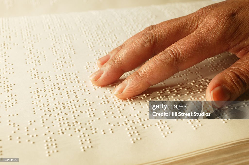 Hand on Braille book