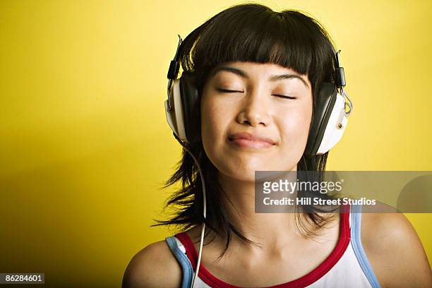 woman with headphones - girl headphones imagens e fotografias de stock