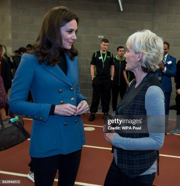 Catherine, Duchess of Cambridge chats with Judy Murray during the Coach Core graduation ceremony for more than 150 Coach Core apprentices at The...