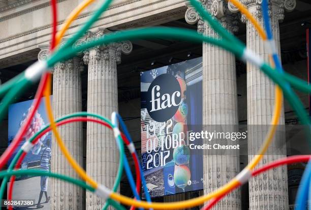 The poster of the exhibition of the edition of the FIAC 2017 is displayed on the facade of the Grand Palais as part of the international contemporary...