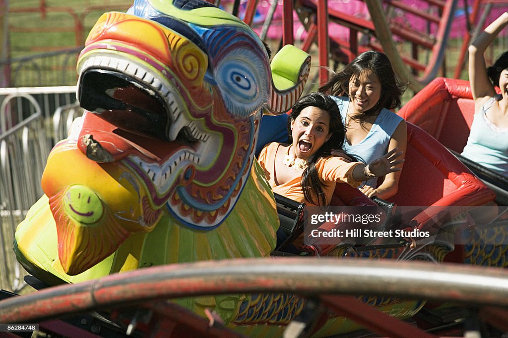 People on amusement park ride