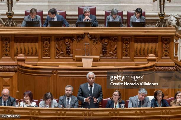 Portuguese Prime Minister Antonio Costa is flanked by his cabinet of ministers while answering to lawmakers questions on Portugal's recent forest...