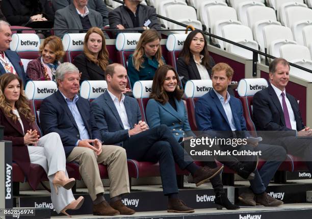 Prince William, Duke of Cambridge and Catherine, Duchess of Cambridge with Prince Harry attend the Coach Core graduation ceremony for more than 150...