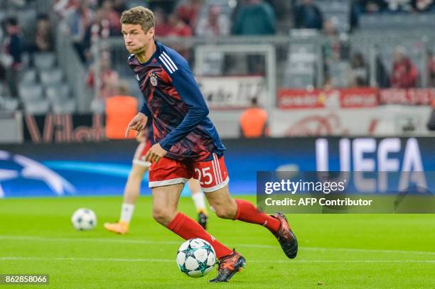 Bayern Munich's German striker Thomas Mueller warms up prior to the UEFA Champions League Group B match between FC Bayern Munich vs Celtic Glasgow at...