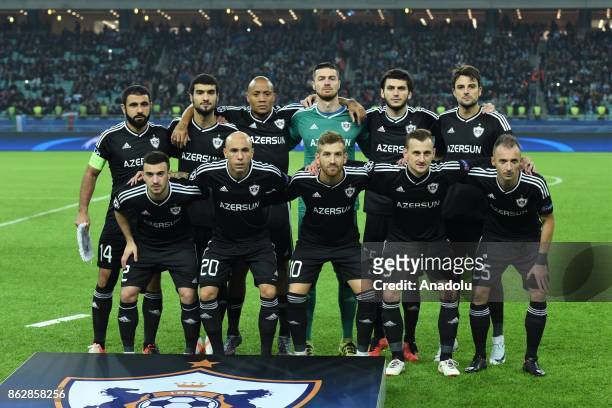 Players of Qarabag Agdam pose for a photo ahead of the UEFA Champions League Group C soccer match between Qarabag Agdam and Atletico Madrid in Baku,...