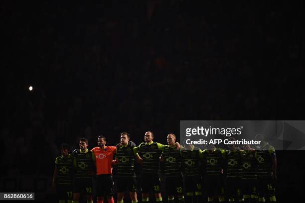 Sporting CP players pay tribute to the victims of fires in Portugal before the UEFA Champions League Group D football match Juventus vs Sporting CP...