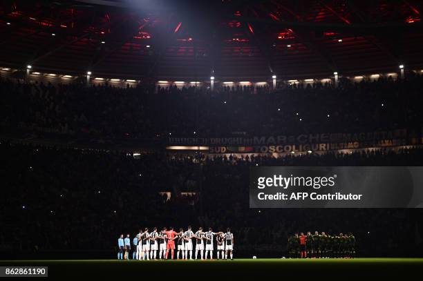 Players pay tribute to the victims of fires in Portugal before the UEFA Champions League Group D football match Juventus vs Sporting CP at the...