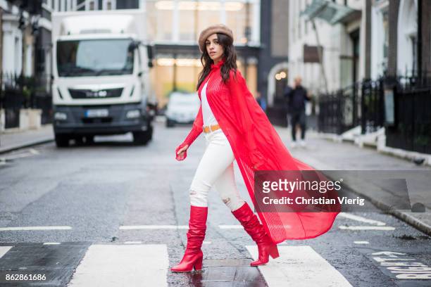Camila Cabello wearing red kimono Ulyana Sergeenko, white pants, brown beret, red Stuart Weitzman boots is seen on October 18, 2017 in London,...