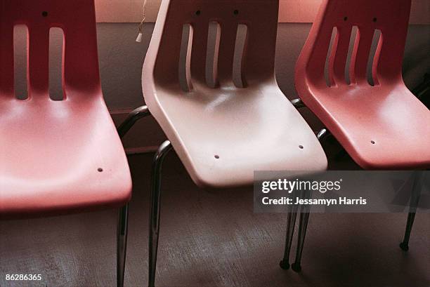 row of plastic chairs - jessamyn harris stock pictures, royalty-free photos & images