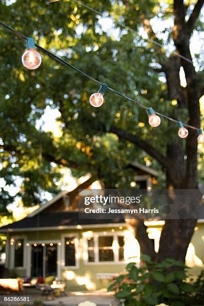string of lights and house - jessamyn harris stock pictures, royalty-free photos & images