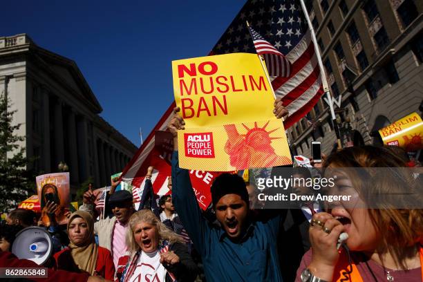 Following a rally in Lafayette Park, activists march toward Trump International Hotel during a protest against the Trump administration's proposed...