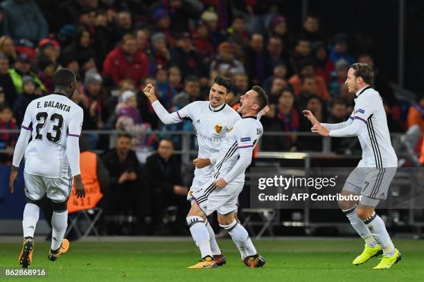 Basel's defender from Albania Taulant Xhaka celebrates with teammates after scoring a goal during the UEFA Champions League Group A football match...