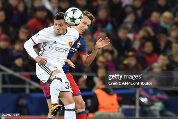 Basel's defender from Albania Taulant Xhaka and CSKA Moscow's midfielder from Sweden Pontus Wernbloom vie for the ball during the UEFA Champions...