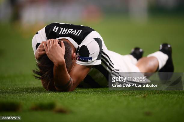 Juventus' forward from Argentina Paulo Dybala reacts during the UEFA Champions League Group D football match Juventus vs Sporting CP at the Juventus...