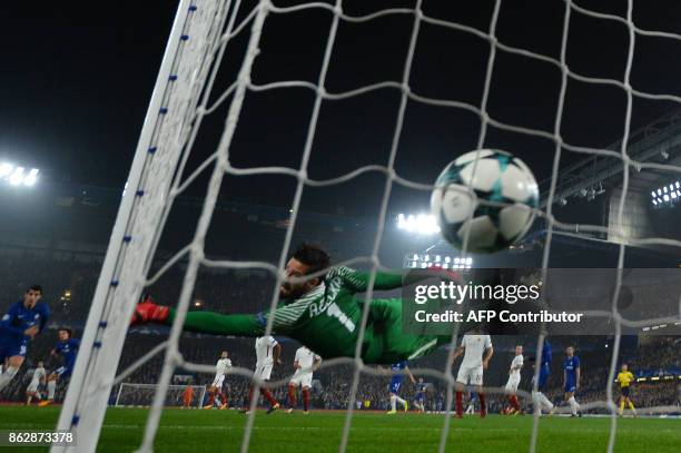 Chelsea's Brazilian defender David Luiz scores past Roma's Brazilian goalkeeper Alisson during a UEFA Champions league group stage football match...