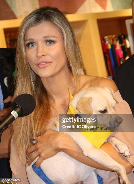 Model Joanna Krupa speaks during a press conference celebrating Calfornia Governor Jerry Brown signing California assembly Bill 485: The Pet Rescue...