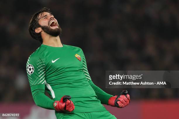 Alisson Becker of AS Roma celebrates after Edin Dzeko of AS Roma scores a goal to make it 2-2 during the UEFA Champions League group C match between...