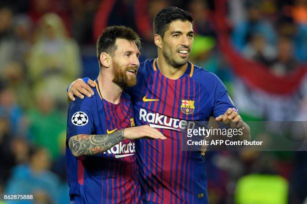Barcelona's Argentinian forward Lionel Messi and Barcelona's Uruguayan forward Luis Suarez celebrate Barcelona's French defender Lucas Digne's goal...