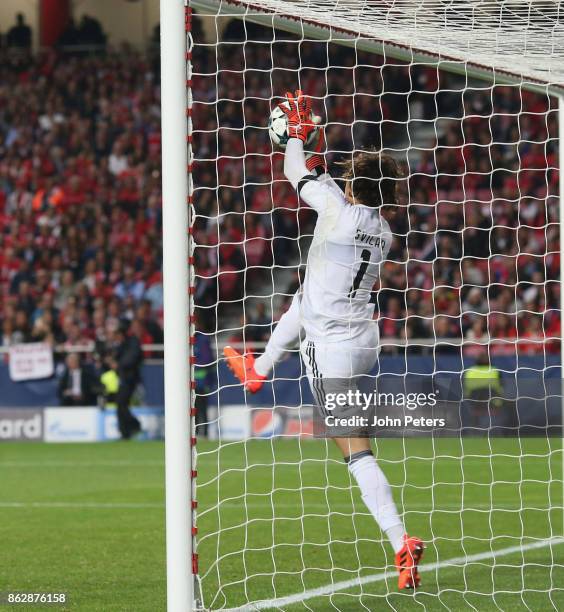 Mile Svilar of Benfica carries the ball into the net to allow Marcus Rashford of Manchester United to score their first goal during the UEFA...