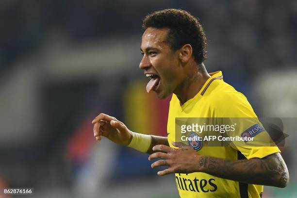 Paris Saint-Germain's Brazilian forward Neymar celebrates scoring a goal during the UEFA Champions League Group B football match between RSC...
