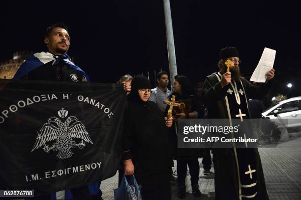 Members of orthodox religious organizations demonstrate outside a theater, protesting against the play of Portuguese writer Fernando Pessoa "The hour...