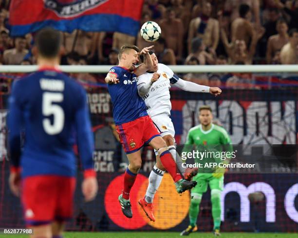 Moscow's midfielder from Sweden Pontus Wernbloom and Basel's defender from Czech Republic Marek Suchy vie for the ball during the UEFA Champions...